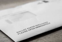Rigged? Trump Slams California Count as Results Drag On Ballot envelope on a wooden surface