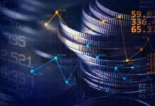Stacked coins with financial data overlay graphs