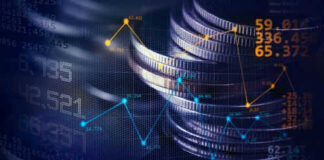 Stacked coins with financial data overlay graphs