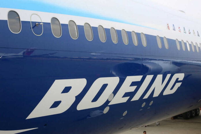 Boeing airplane fuselage with windows and large logo