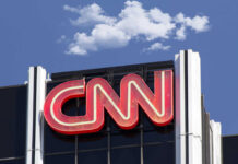 Wild ‘Nazi’ Allegation Stuns CNN Panel CNN building sign and blue sky background