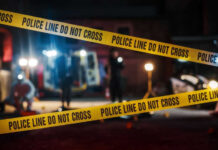 Holiday Massacre Rocks Coney Island Police tape cordons off a nighttime crime scene