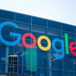 Google logo on glass building facade.