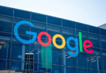 Google logo on glass building facade.