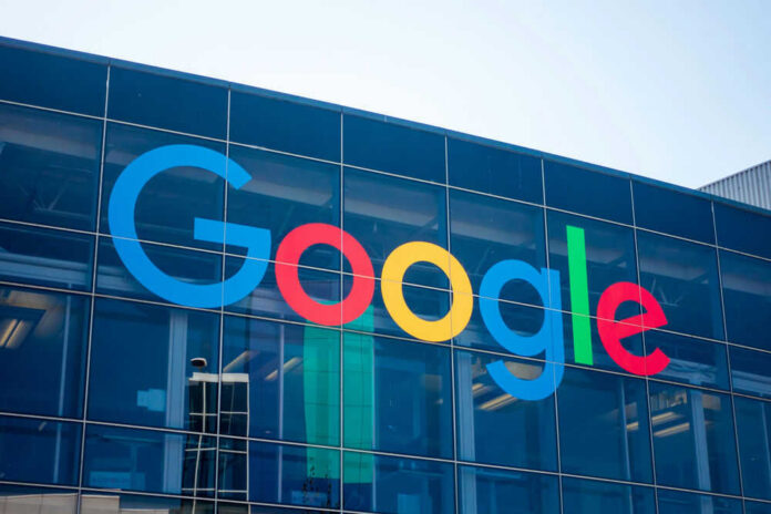 Google logo on glass building facade.