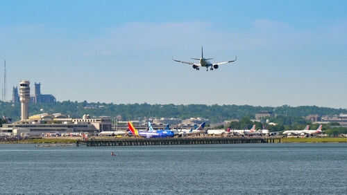 reagan-airport2488885957jpg Airplane landing at busy airport near water