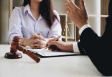 Corporate Confess-And-Walk? DOJ’s Bold Shift Two people in a legal consultation at a desk