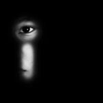 Amber Alert Sparks Interstate Hotel Standoff face peering through a keyhole in darkness