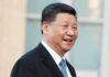 Beijing’s Ban Rattles NATO Supply Chains man in suit smiling outdoors