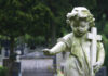 Stoned Dad, Hot-Car Horror Sparks Murder Charge Weathered angel statue holding a cross in a cemetery