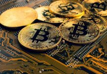 Bitcoin coins on a circuit board