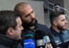UK Extradition Twist Snags Tate Brothers Man speaking to reporters with microphones outside a building
