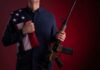 Veteran Firebrand Torches Gun-Free Myths Speaker at podium raising a fist during a conference