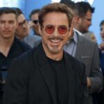 Crowd ERUPTS As Downey Shuts Down Deadpool smiling man in sunglasses at a public event