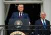 Death Decrees Target Trump, Netanyahu Two men standing at a podium outdoors