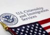 Citizenship Crackdown Explodes — Who’s Next? U.S. Citizenship and Immigration Services document with American flag