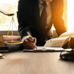 Congress Probes AI-Tainted Judgments Lawyer writing at desk with scales and gavel