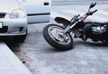 Motorcycle Mayhem on I‑76 — Lane-Splitting Fight Erupts Motorcycle lying on the street beside a car with an open door