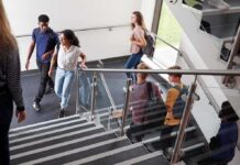 Influence Web Exposed: Campuses To Unions Students walking on a school staircase