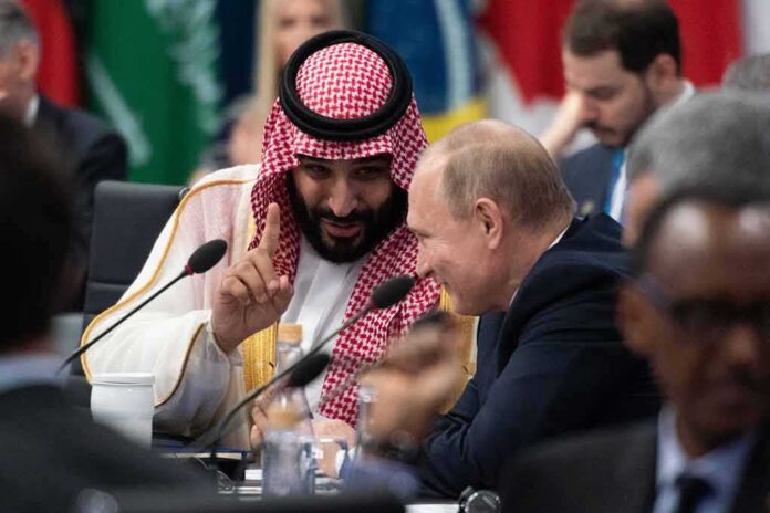 Two delegates converse at an international summit table