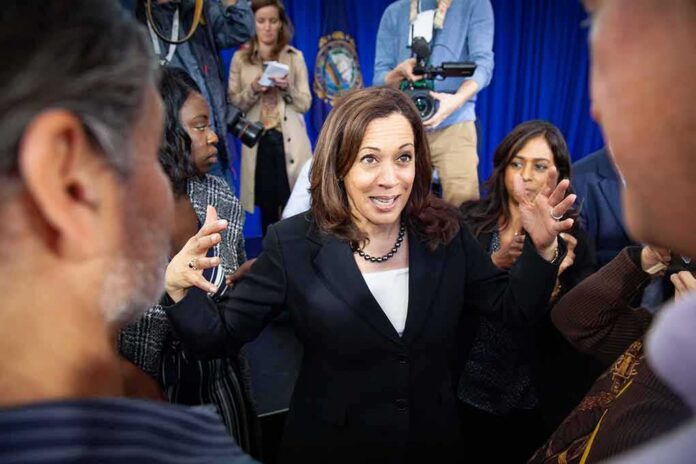 shutterstock_1380838391 Woman in black blazer speaking animatedly to a crowd