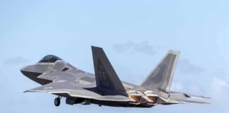 Stealth fighter jet taking off from runway