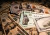 United States Treasury check on a pile of US dollar bills