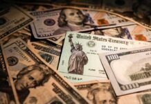 United States Treasury check on a pile of US dollar bills
