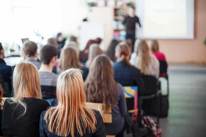 Students seated in a classroom listening to a presentation