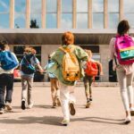 Religion Pushed Aside—Bishops Blast Warsaw’s Power Grab Group of schoolchildren with backpacks running toward a school entrance