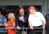 Faith Leaders Move To Muzzle Carlson? group of people on a balcony at a golf event