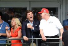 Faith Leaders Move To Muzzle Carlson? group of people on a balcony at a golf event