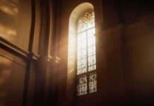 sunlit stained glass window in a church interior