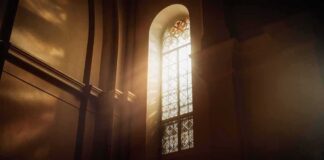 sunlit stained glass window in a church interior