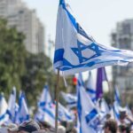 Hezbollah Pushes, Israel Punches Back Israeli flags waved at a street demonstration