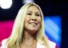 Biden Bombshell: MTG, Massie Get Love Smiling blonde woman speaking on stage