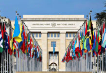 Netanyahu CRUSHES Mamdani’s Rhetoric, Mass Walkouts United Nations building with numerous national flags outside.