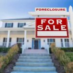 As-Is Foreclosure Deal, Three Bodies Inside For sale sign in front of suburban house