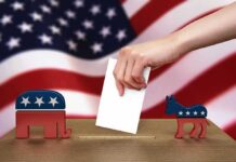 Election Shields Up: Pentagon Goes Hunting Hand casting ballot between Republican elephant and Democratic donkey