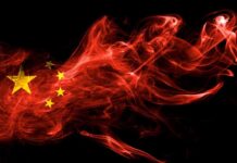 Beijing Playbook Inside U.S. Nonprofits? Chinese flag in red smoke on black background