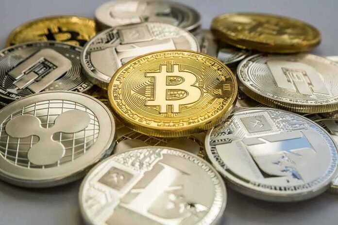 shutterstock_1132017965 Stack of assorted cryptocurrency coins with a gold bitcoin in the center