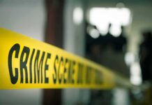 Alibi Cracks – Idol Star’s Intruder Story Unravels crime scene tape in a blurred indoor setting