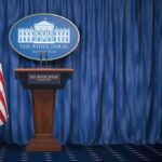 Broken Radios. Plane Climbs Into Presidential Airspace White House press briefing podium with U.S. flag and blue curtain