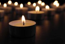 Rackets Exposed In Super Bowl Death Tealight candle burning with soft glow