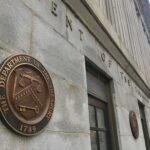 Private Schools Warned: Drop Race Sorting U.S. Treasury building exterior with bronze seal on stone wall