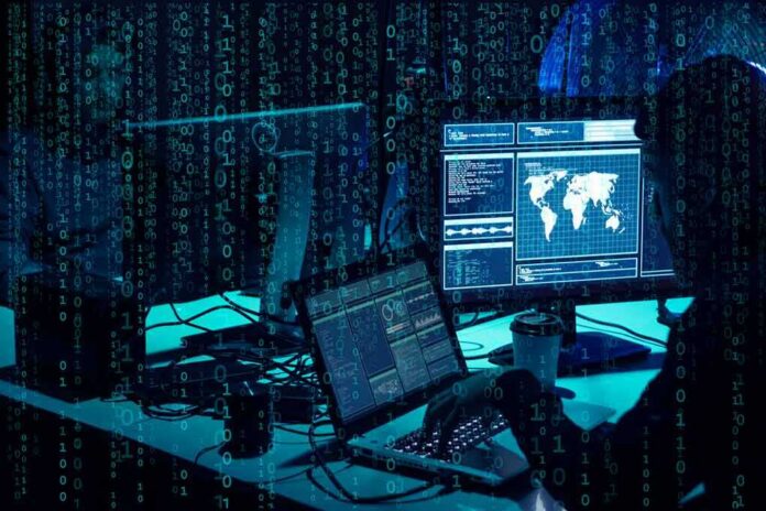 shutterstock_1399823822 cybersecurity analysts at workstations with code and world map on screens