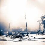 Empty concert stage with instruments and bright lights