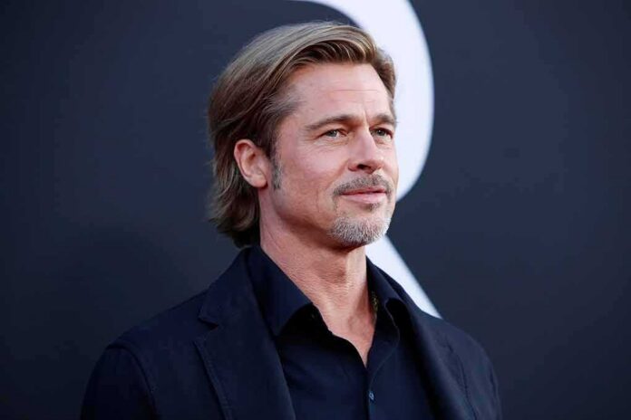 Brad Pitt on a red carpet in a dark suit