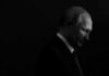 Russia Eyes NATO? Europe’s Defenses Probed Vladimir Putin in profile, side-lit against a dark background