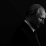 Russia Eyes NATO? Europe’s Defenses Probed Vladimir Putin in profile, side-lit against a dark background